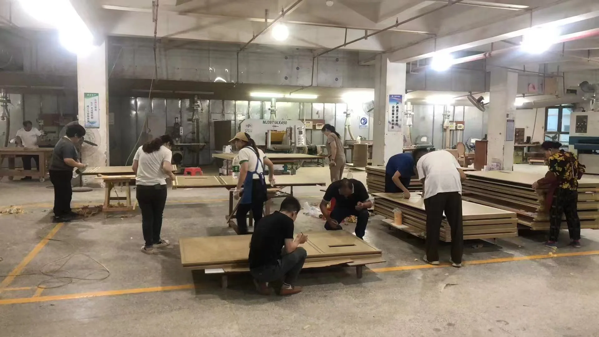 Factory team inspecting completed furniture